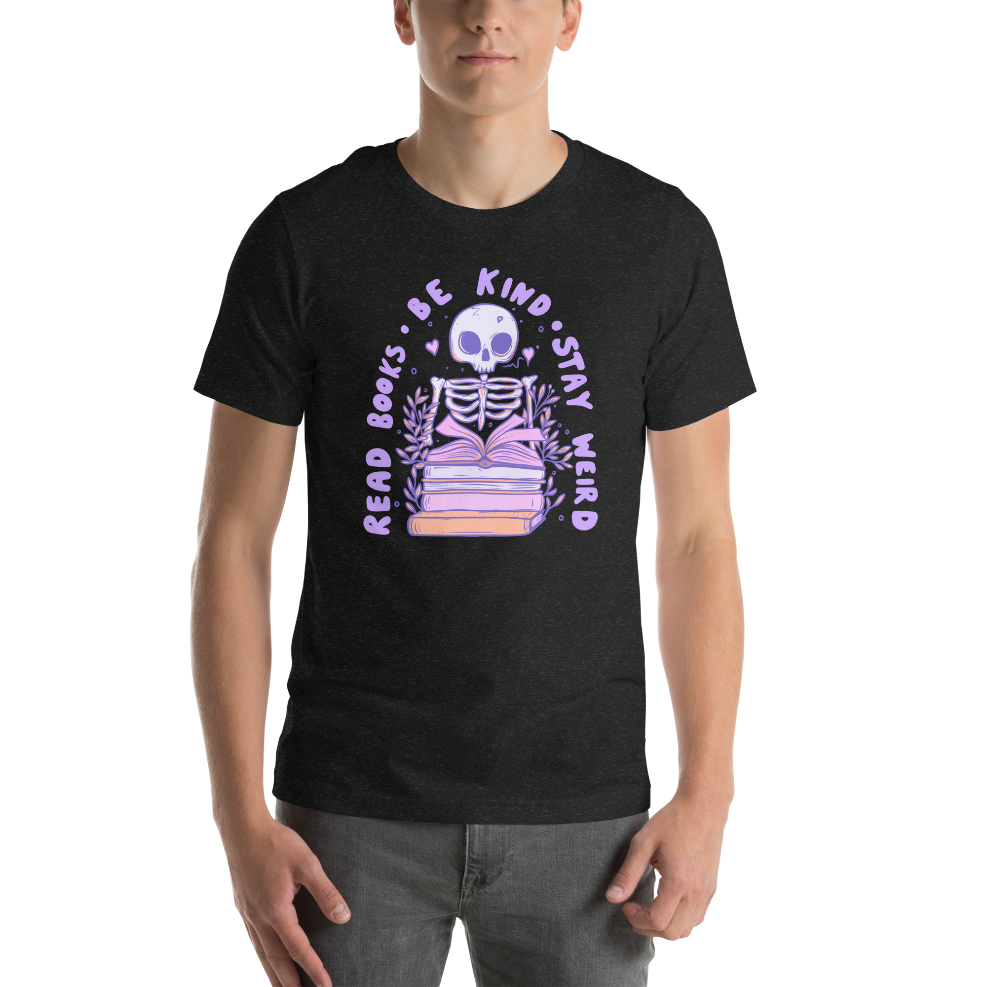 Bookish T-Shirt featuring a pastel skeleton reading among books with the text 'Read Books Be Kind Stay Weird'.
